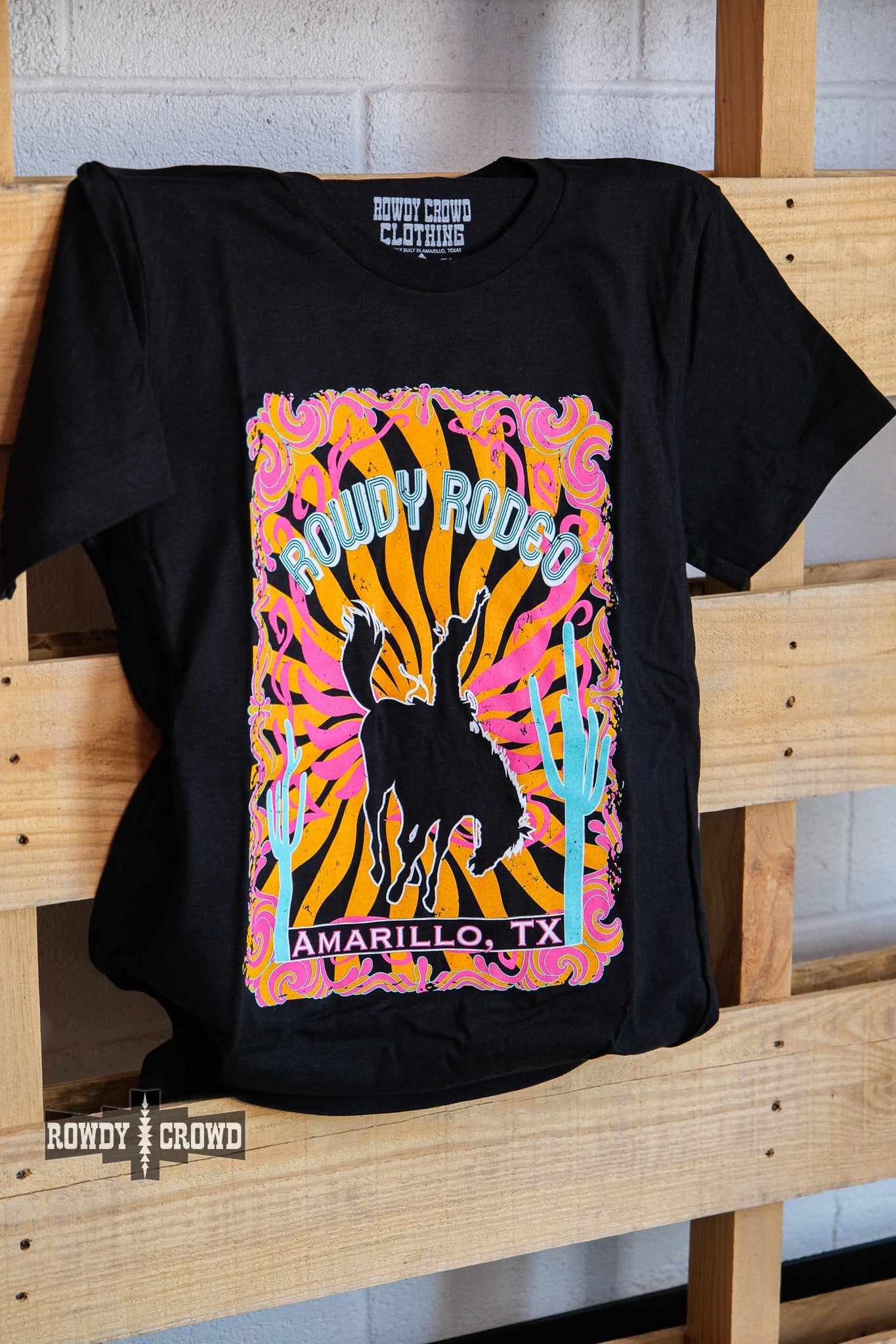 western apparel, western graphic tee, graphic western tees, wholesale clothing, western wholesale, women's western graphic tees, wholesale clothing and jewelry, western boutique clothing, western women's graphic tee, cowboy print tee, bucking bronc tee, rodeo tee